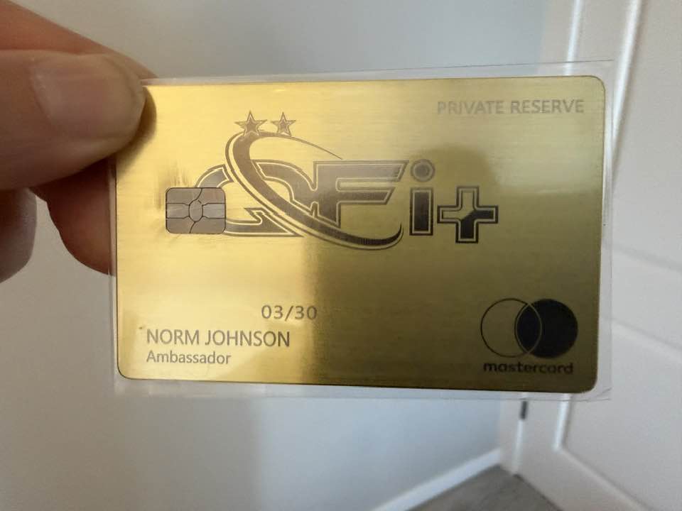 QFi Plus Private Reserve gold card with embedded chip and gold typography